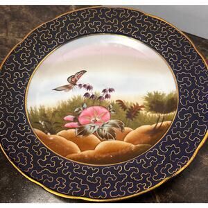 Two Antique Butterfly Plates with Gold Cloisonné Trim on the Rims.